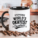 World's Okayest Coworking Funny Mugg<br><div class="desc">Fira en känsla av humor på arbetsplatsen med denna "World’s Okayest Coworking" personlig mugg. Perfekt för medarbetare med en lekfull anda. Med mugg kan du lägga till deras namn för en unik beröring. Det är en perfekt gåva till kontorsevenemang, hemlig tomt, eller bara för att lägga till lite roligt på...</div>