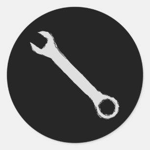 Wrench. Grått och svart. Spanner. Runt Klistermärke