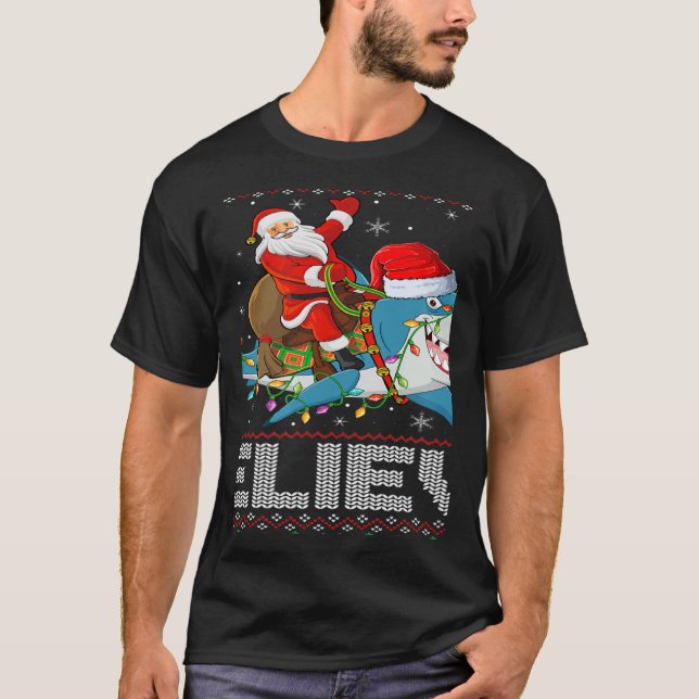 Xmas Lights Shark Believe Ugly Santa Riding Shark  T Shirt (Framsida)