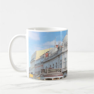 YELLOW TRAM ON ROAD KAFFEMUGG