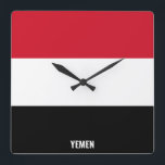 Yemen Flagga Dazzling Patriotic Fyrkantig Klocka<br><div class="desc">Jemen Flagga Dazzling Patriotic Square Wall Clock i färg och inslag i Jemens nationella flagga som täcker framsidan av klockan. Flagga kompletteras med texten "Jemen" på grund. Anpassadet Text är fullt ut med funktionen "Anpassa den!". Du kan ändra den, ta bort den eller lägga till en egen. Den här charmerande...</div>