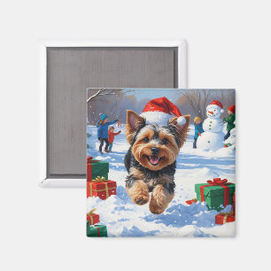Yorkipoo springar i snö med julhatt magnet