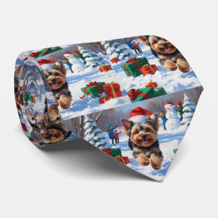 Yorkipoo springar i snö med julhatt slips