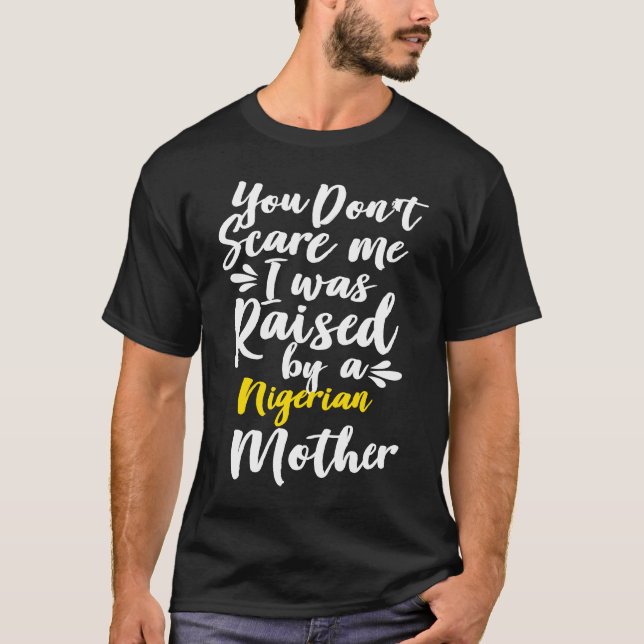 You Don't Scare Me I Was Raised By A Nigerian T Shirt (Framsida)