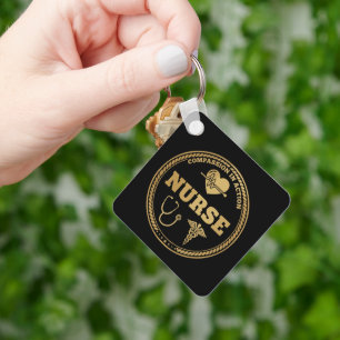Yrkesmässig sjuksköterskeemblem   Medkänsla i hand Nyckelring
