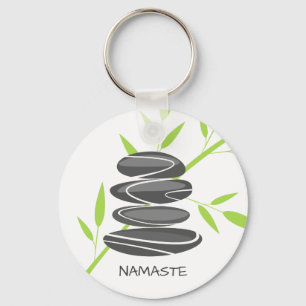 Zenpebblestenar som staplar meditationkeychains nyckelring